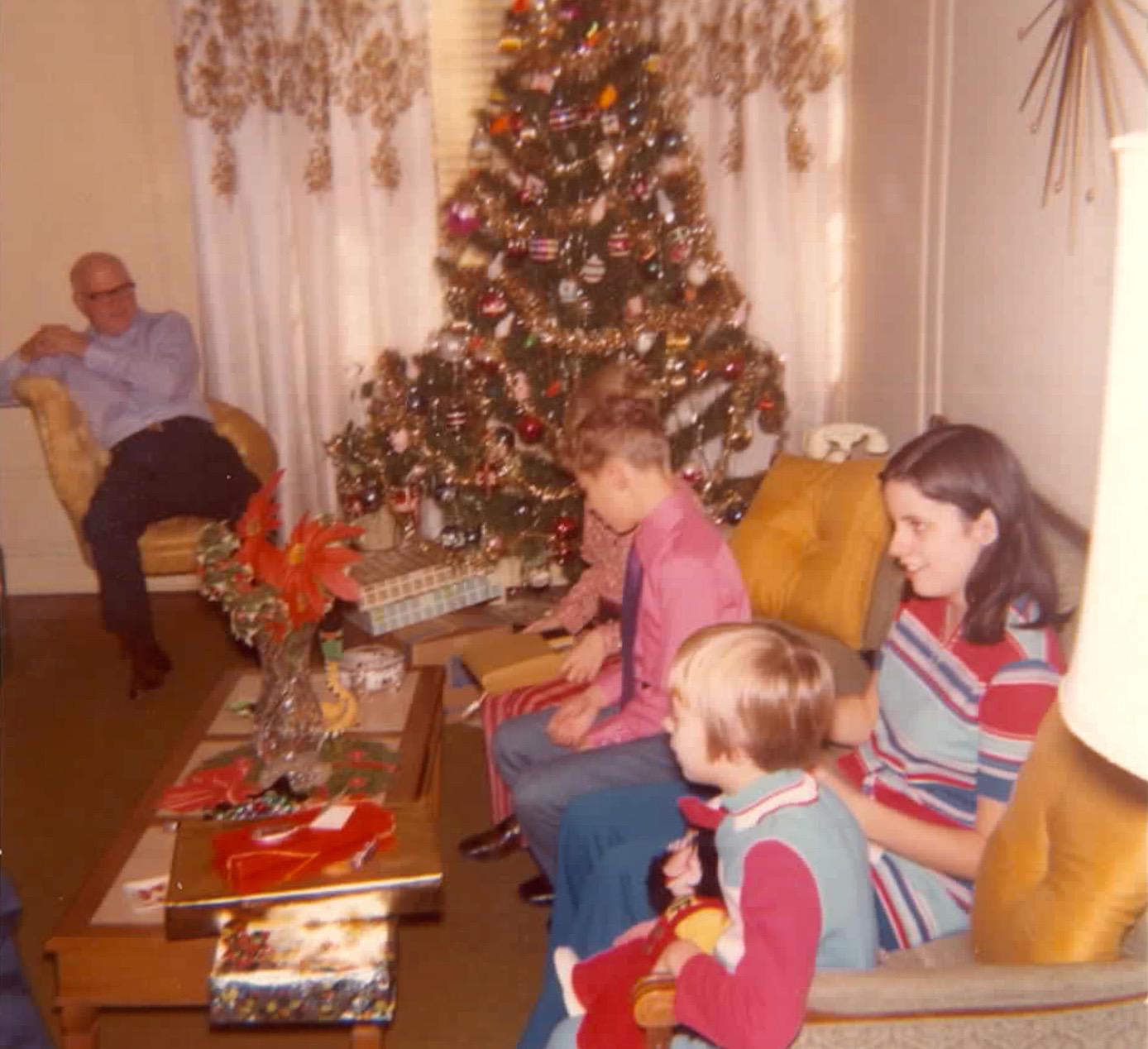 Christmas Day, 1972 (a year after the last photo) again at my grandparent's place, Queens NY. My cousin has the updated Zip the Chimp!