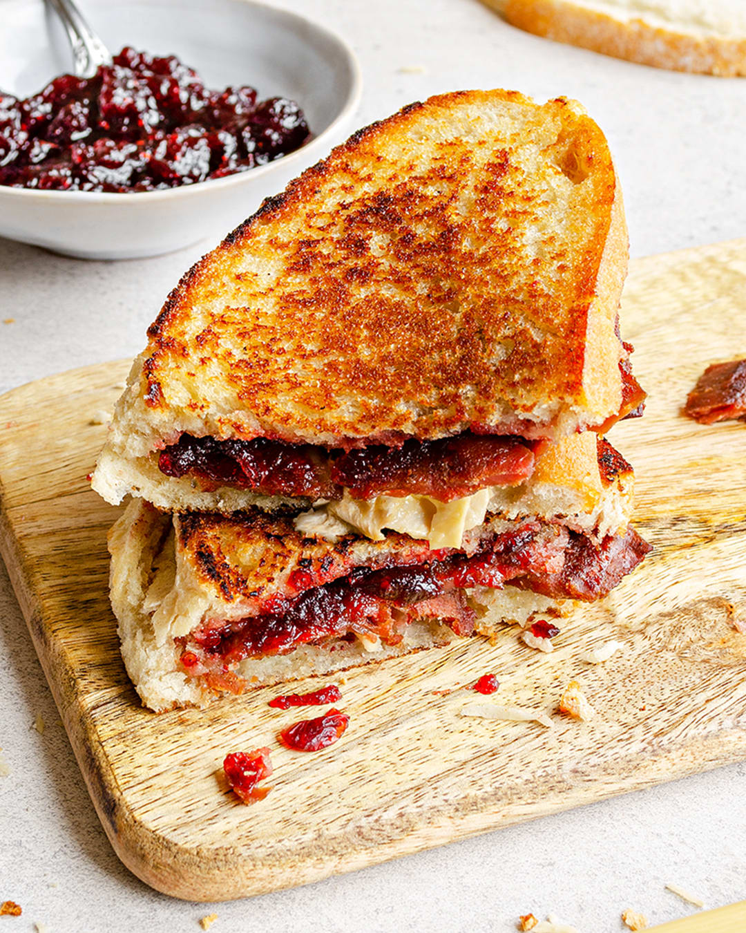 Vegan bacon, cranberry and vegan camembert cheese toastie
