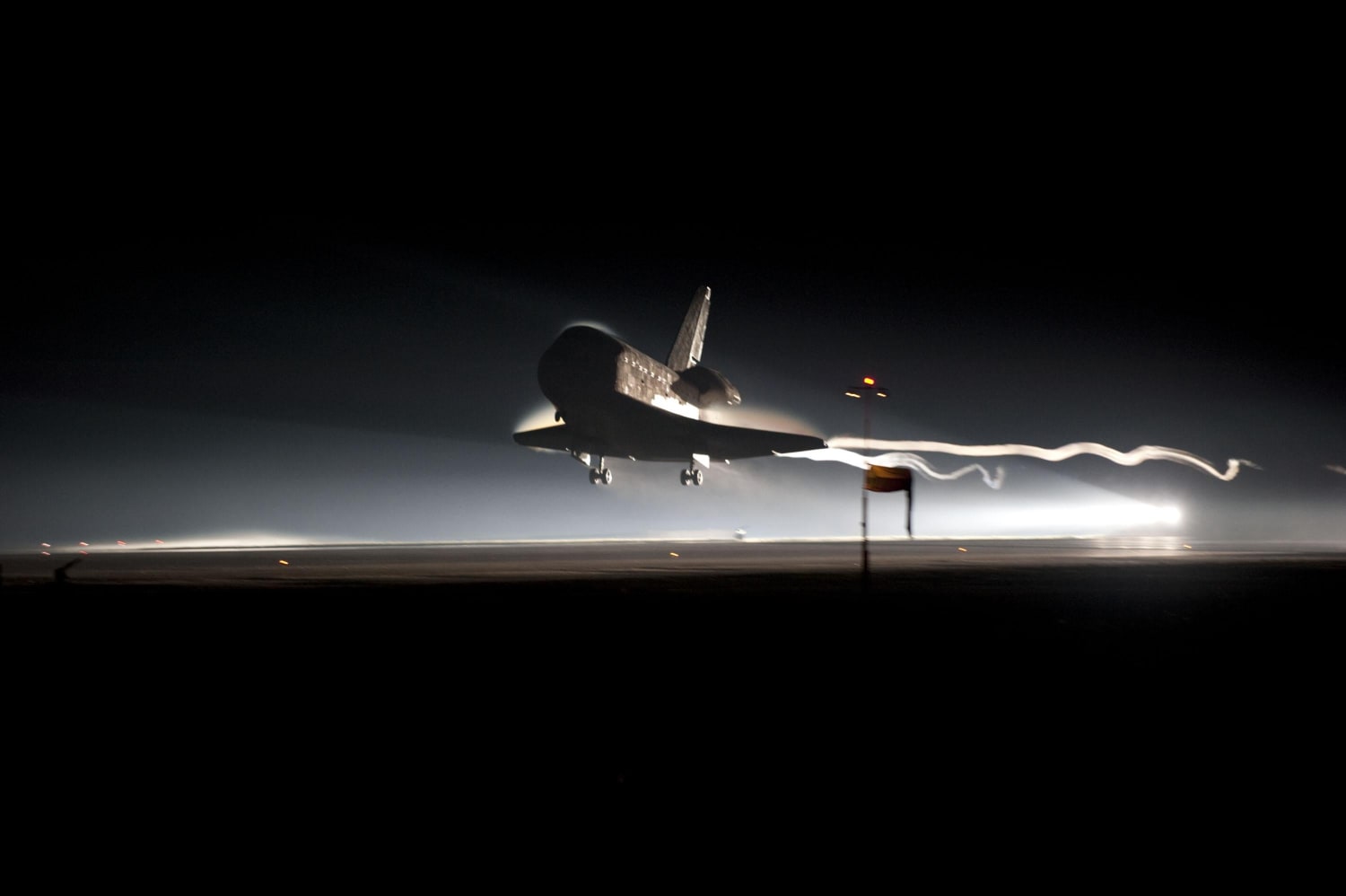 Atlantis on short final to Kennedy Space Center's Shuttle Landing Facility after a 200-orbit 5,284,862-mile flight to conclude the final mission of the Space Shuttle Program (STS-135), July 21, 2011