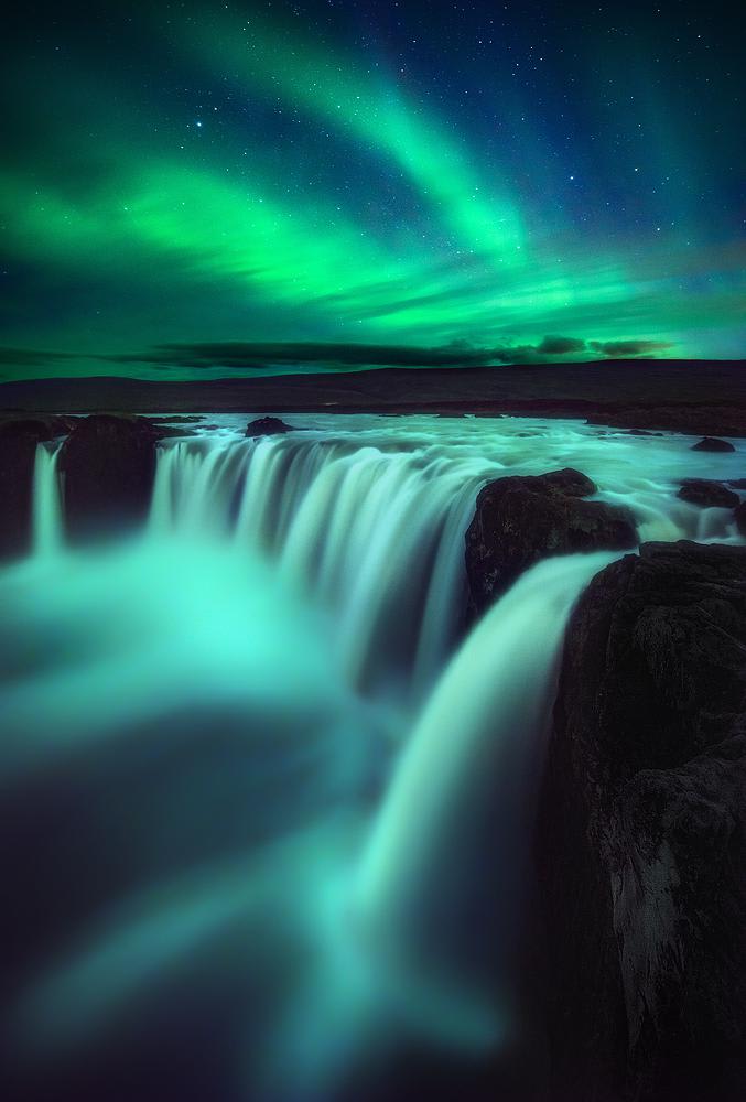 Northern Lights over Godafoss Waterfall in Iceland IG: @joseramosphotography